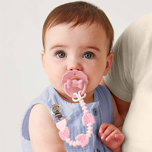 Itzy Paci Strap Plus™ | Pink Bows